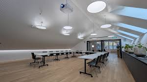 Modern boardroom with natural lighting and AV integration