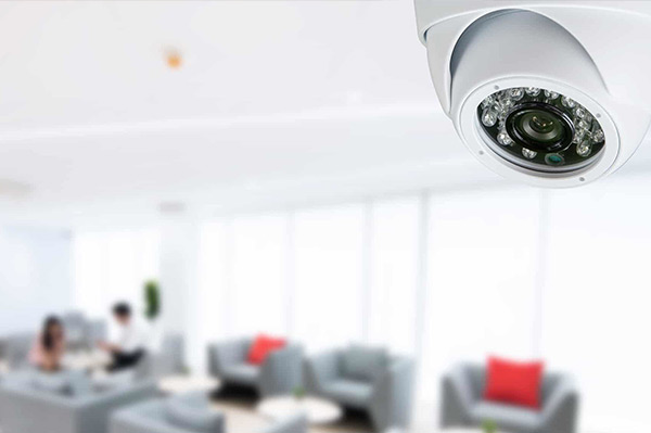 Modern dome security camera in professional office environment