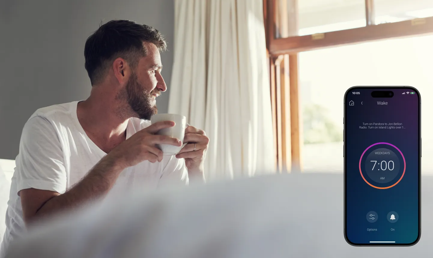 Man enjoying morning coffee with smart home wake-up automation on smartphone